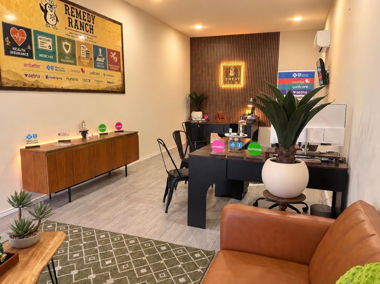 Remedy Ranch office interior with desks and a Remedy Ranch wall display